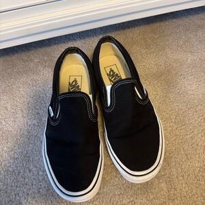 Vans Unisex Classic Black and White Slip-On Sneakers